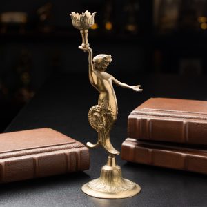 Exquisite handmade bronze candlestick in the form of the god Ooz