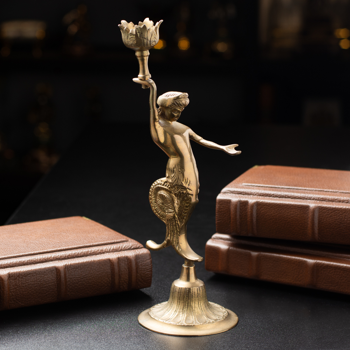 Exquisite handmade bronze candlestick in the form of the god Ooz